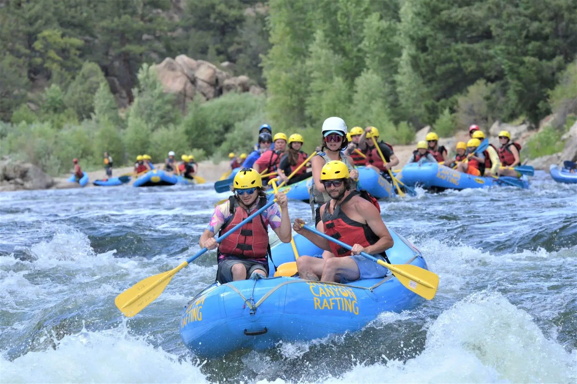 Browns Canyon River Trips Raft gliding between granite rock formations during one of our many Browns Canyon river trips on the Arkansas River through Browns Canyon Monument with Browns Canyon Rafting in Buena Vista, Colorado.
