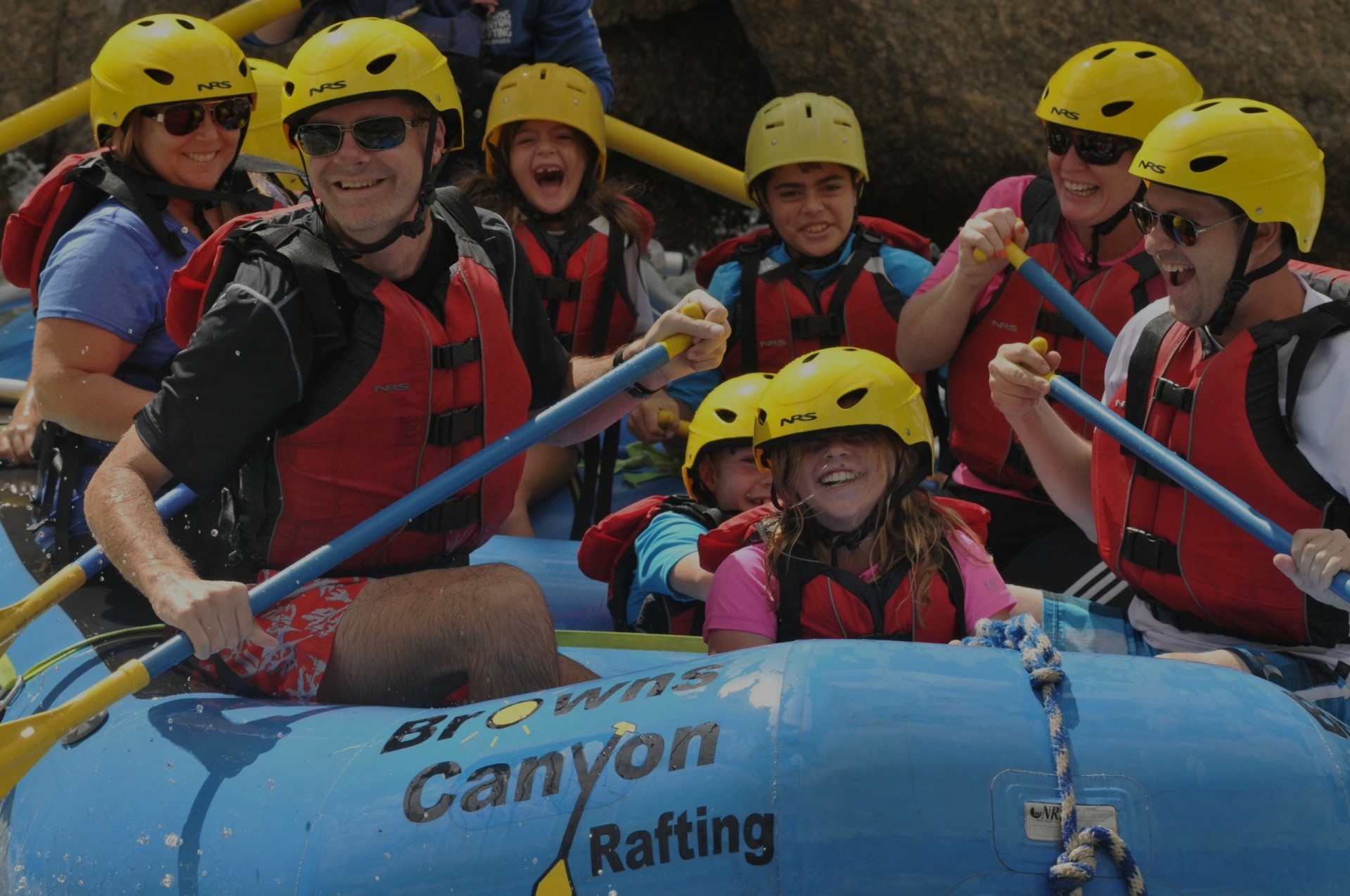 Men, women and children enjoying a gentle family float half day rafting trip on the Arkansas River in Buena Vista, Colorado.