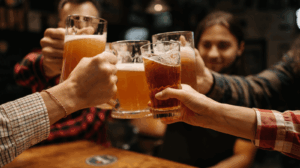 Bartender pouring craft beer at a Buena Vista taproom after a day of rafting.
