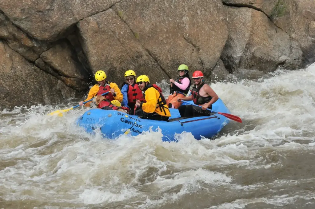 Rafting crew navigating a technical Class IV rapid on The Numbers section of the Arkansas River