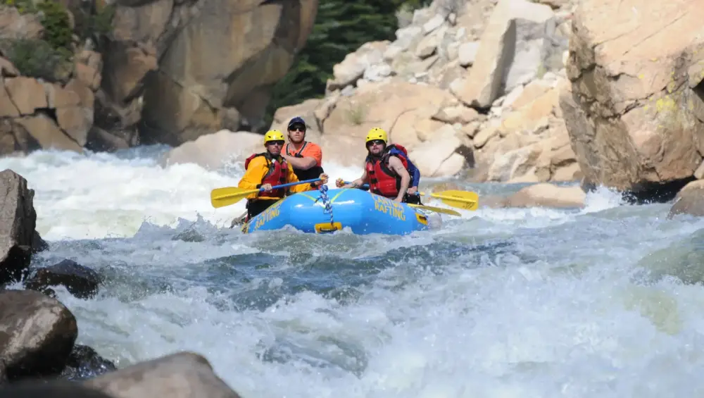 Adventure rafting through steep, rocky rapids on The Numbers in Colorado