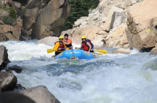 Adventure rafting through steep, rocky rapids on The Numbers in Colorado